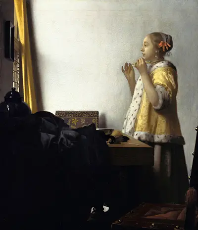 Woman with a Pearl Necklace Vermeer